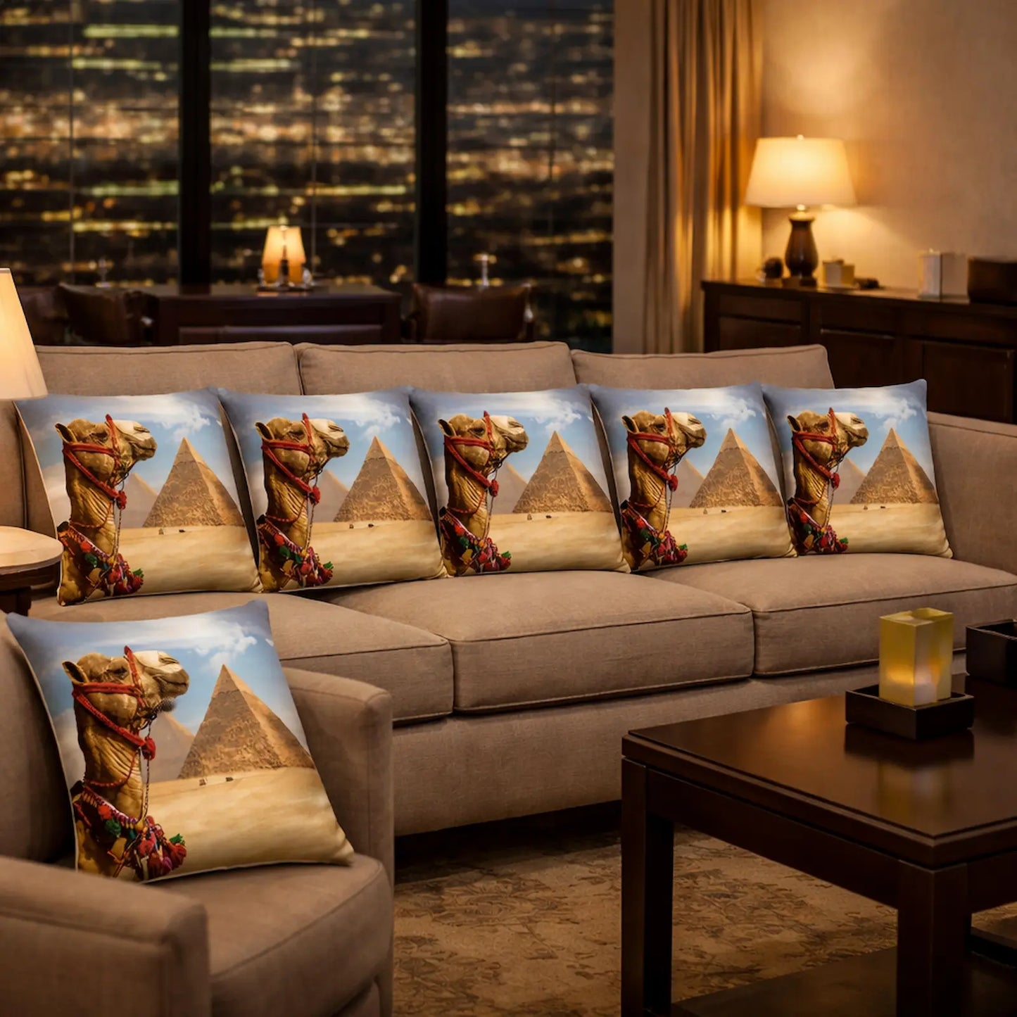 Decorative pillows with pyramid and camel design on a sofa in a living room.