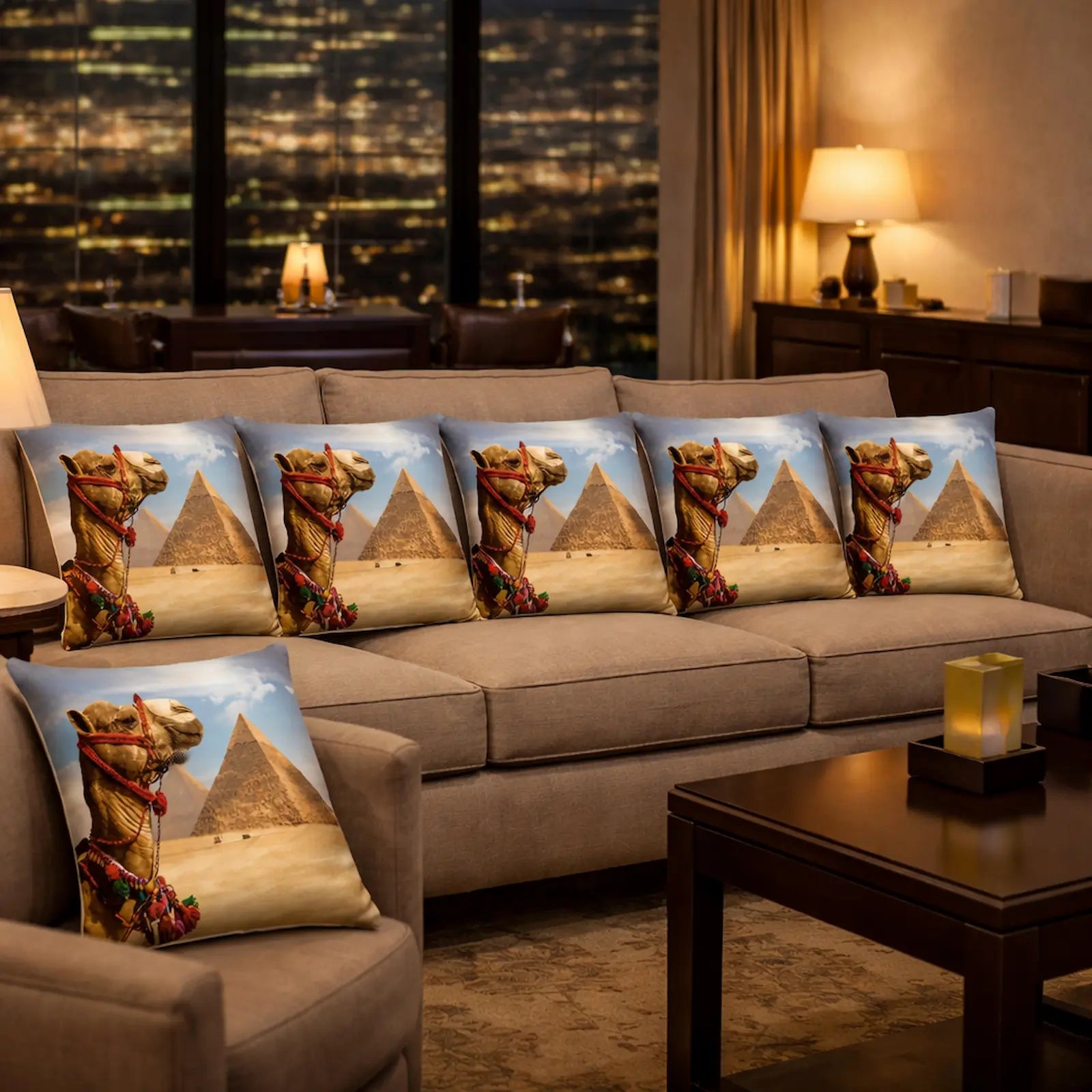 Decorative pillows with pyramid and camel design on a sofa in a living room.